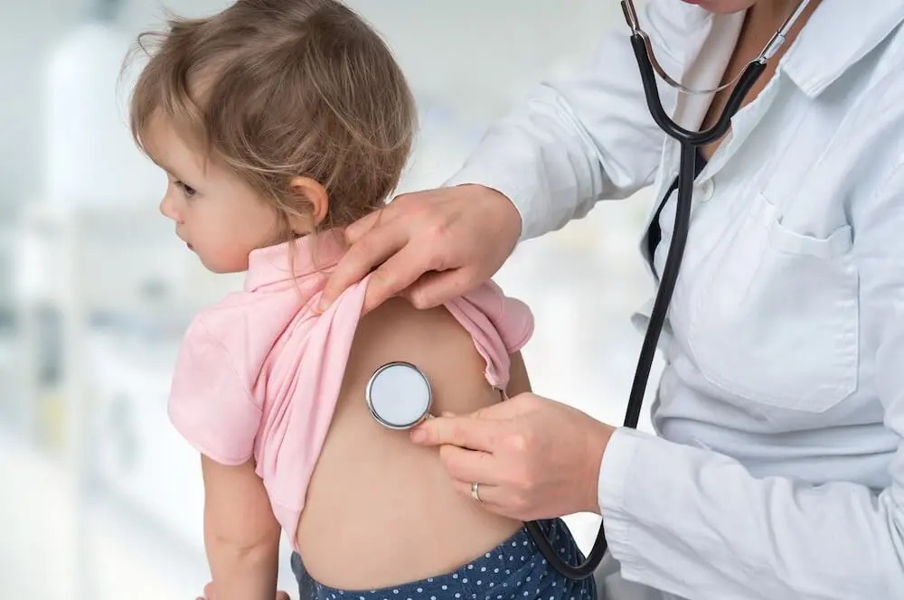 Dr. Hashemi examining a young patient