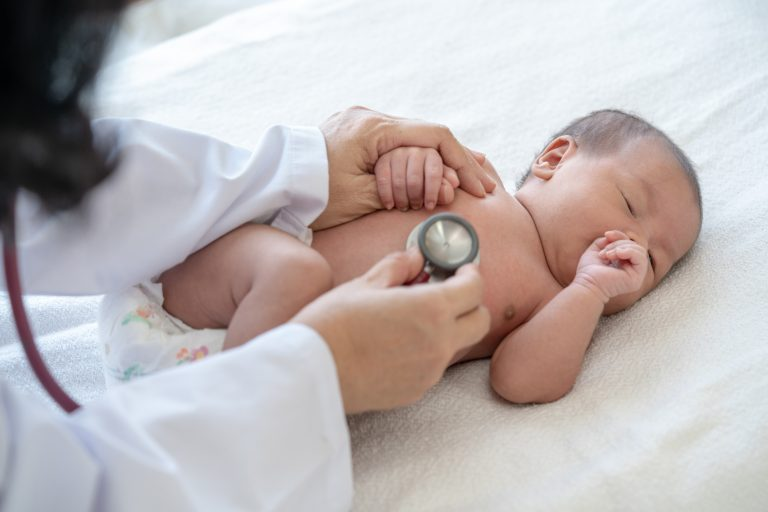 A newborn during a gentle checkup